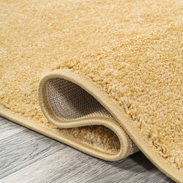 Haze Solid Low-pile Area Rug Mustard